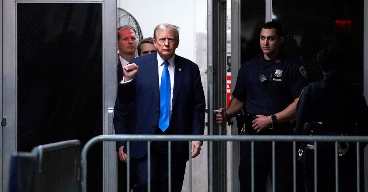 Former President Donald Trump gestures in the hallway outside the courtroom as he returns from a recess at Manhattan criminal court in New York, Thursday, April 18, 2024. (Timothy A. Clary/Pool Photo via AP)