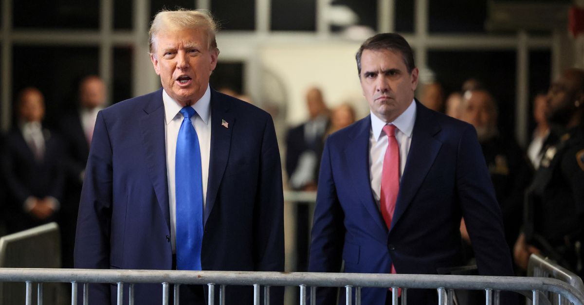 Republican presidential candidate and former President Donald Trump speaks to reporters, next to his attorney Todd Blanche, at Manhattan state court in New York, Monday, April 22, 2024. (Brendan McDermid/Pool Photo via AP)