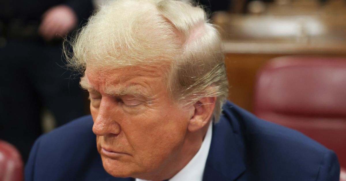 Former president Donald Trump, center, awaits the start of proceedings at Manhattan criminal court, Monday, April 22, 2024, in New York. Opening statements in Donald Trump's historic hush money trial are set to begin. (AP Photo/Yuki Iwamura, Pool)