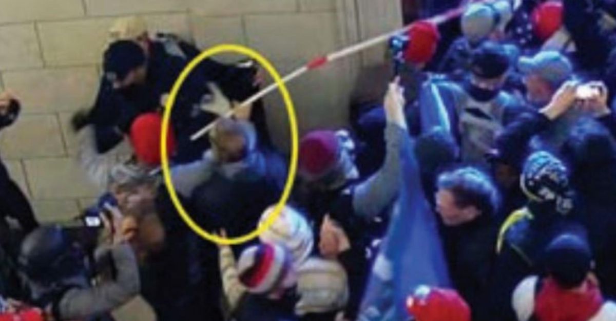 Justice Department provided photo shows William Gallagher circled in yellow pushing a police officer inside the U.S. Capitol on Jan. 6, 2021. 